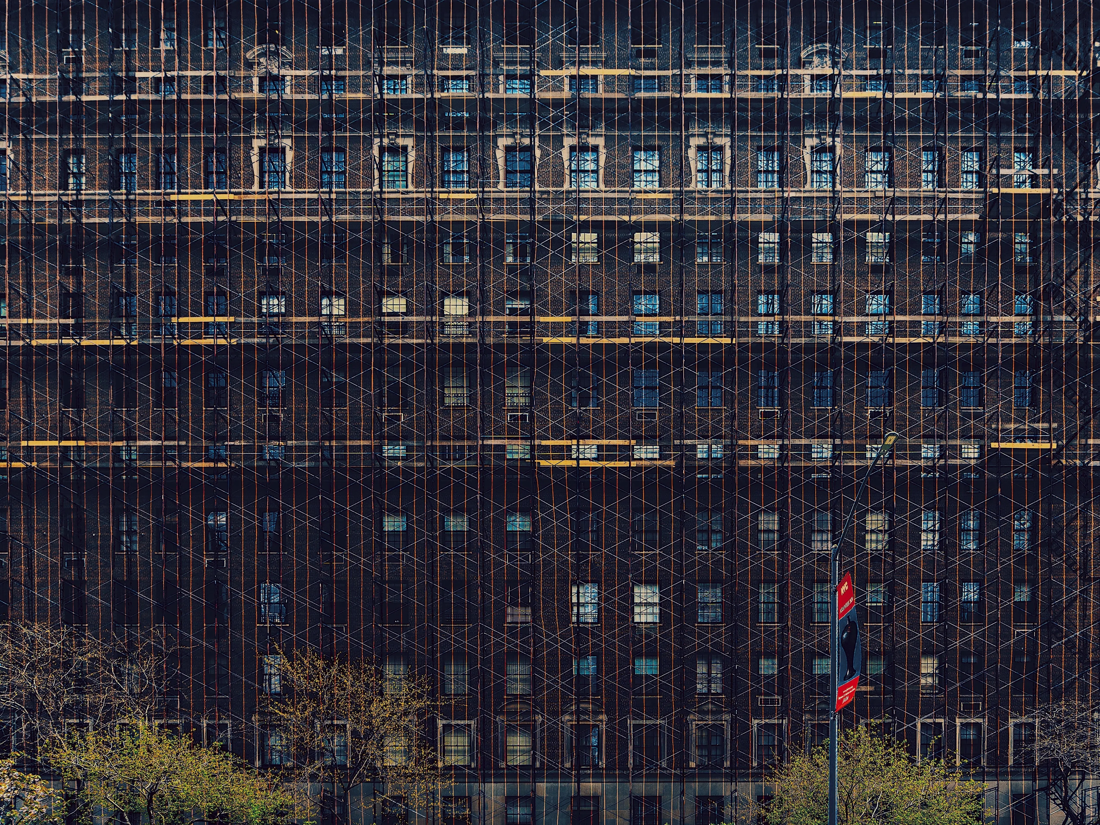 Building covered in scaffolding, ongoing exterior restoration, LL11 project, Ethos PM Group